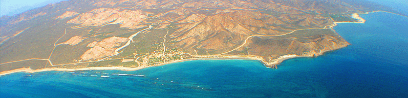 arial view of the Cabo Pulmo Reef structure, surrounding half-moon mountain trimmed bay and mexican village of Cabo Pulmo in Baja Sur Mexico