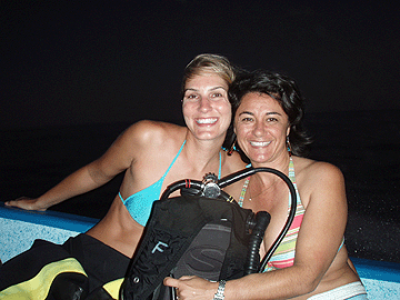 Stacy and Cole's wife in boat on way out to night dive.